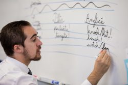 teacher writing on board